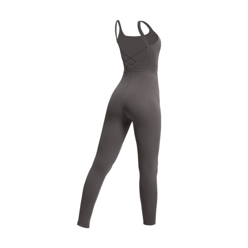 Stylish elastic women's open back fitness jumpsuit in solid color with crisscross back design, perfect for yoga and workouts.